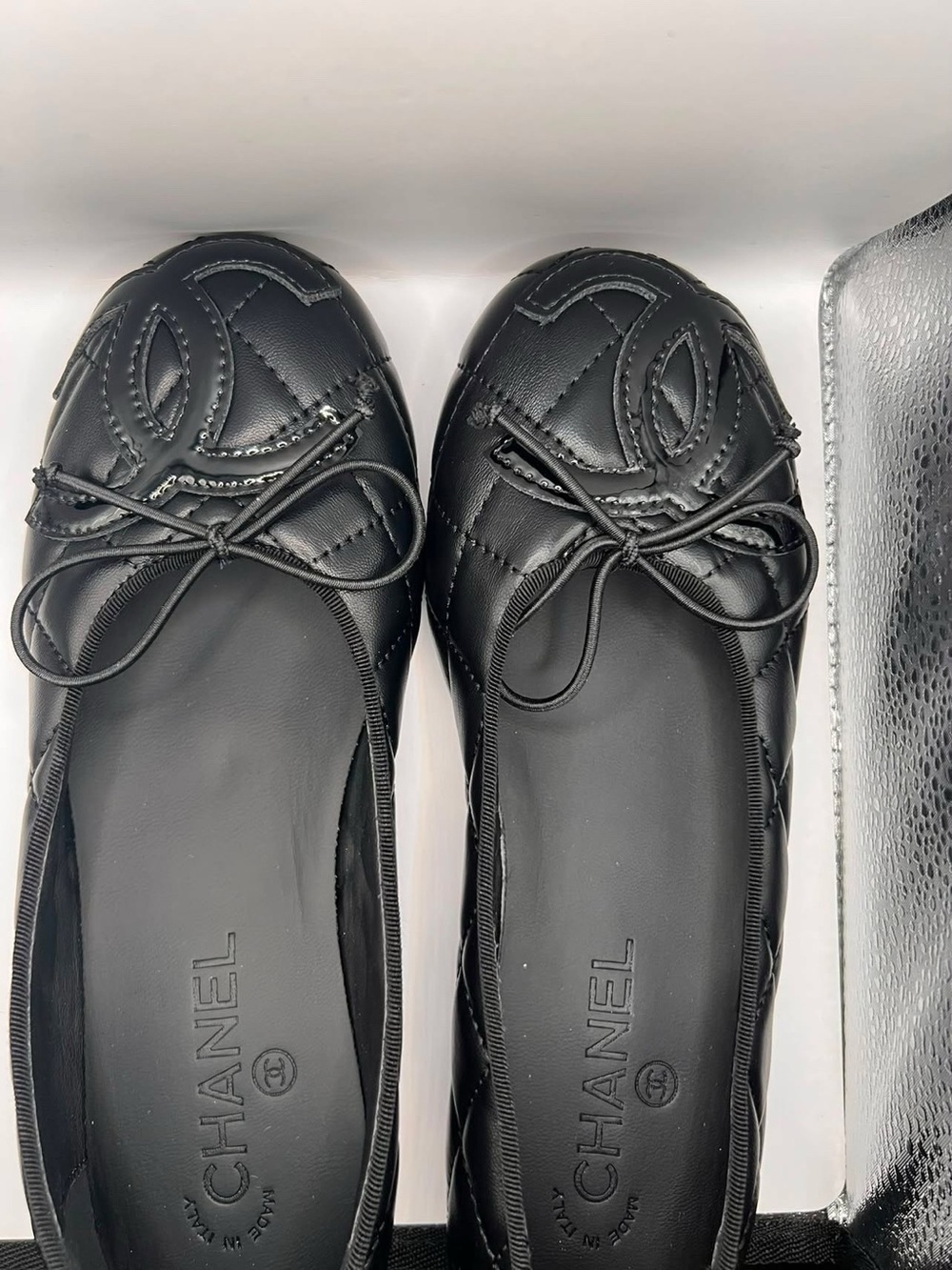 CHANEL Black Quilted Logo Ballet Flats with Bow